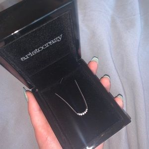 White gold 7 diamond cross necklace